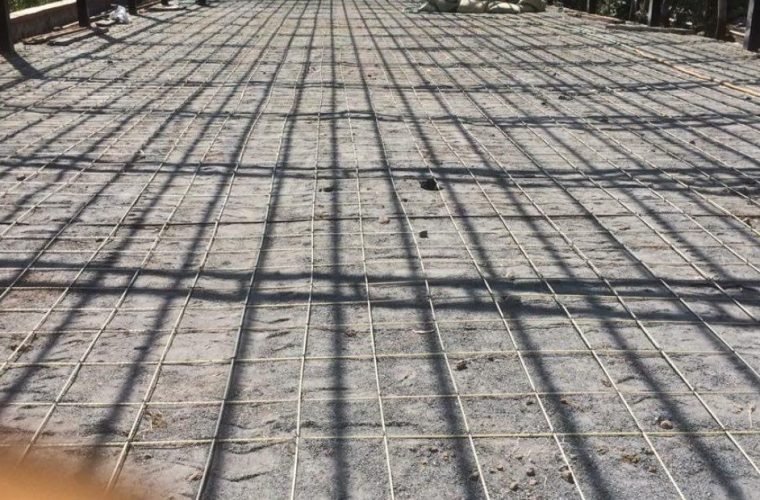 GFRP rebar mesh by Grandform Fiber laid over a large floor slab before concreting